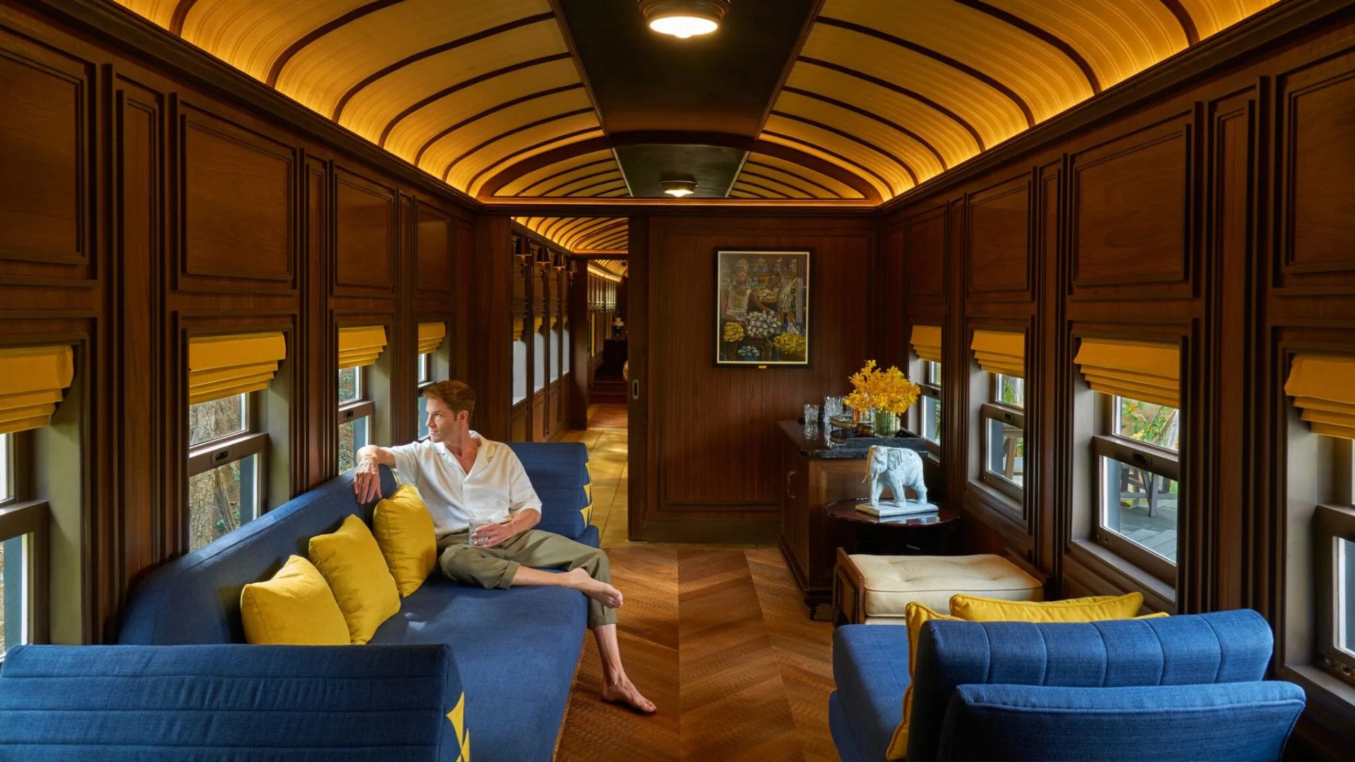 A-man-is-sitting-indoor-of-Heritage-Railcar-Pool-Villa-2048x1152.jpg